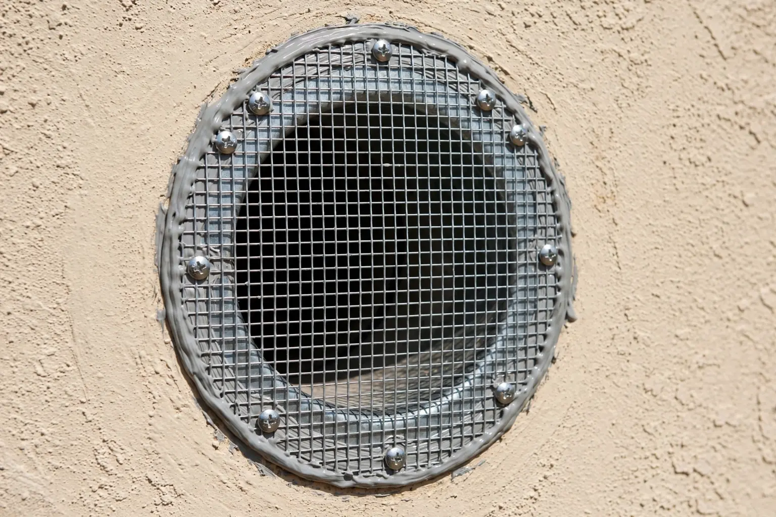 Rodent proof stainless steel mesh installed over a home vent
